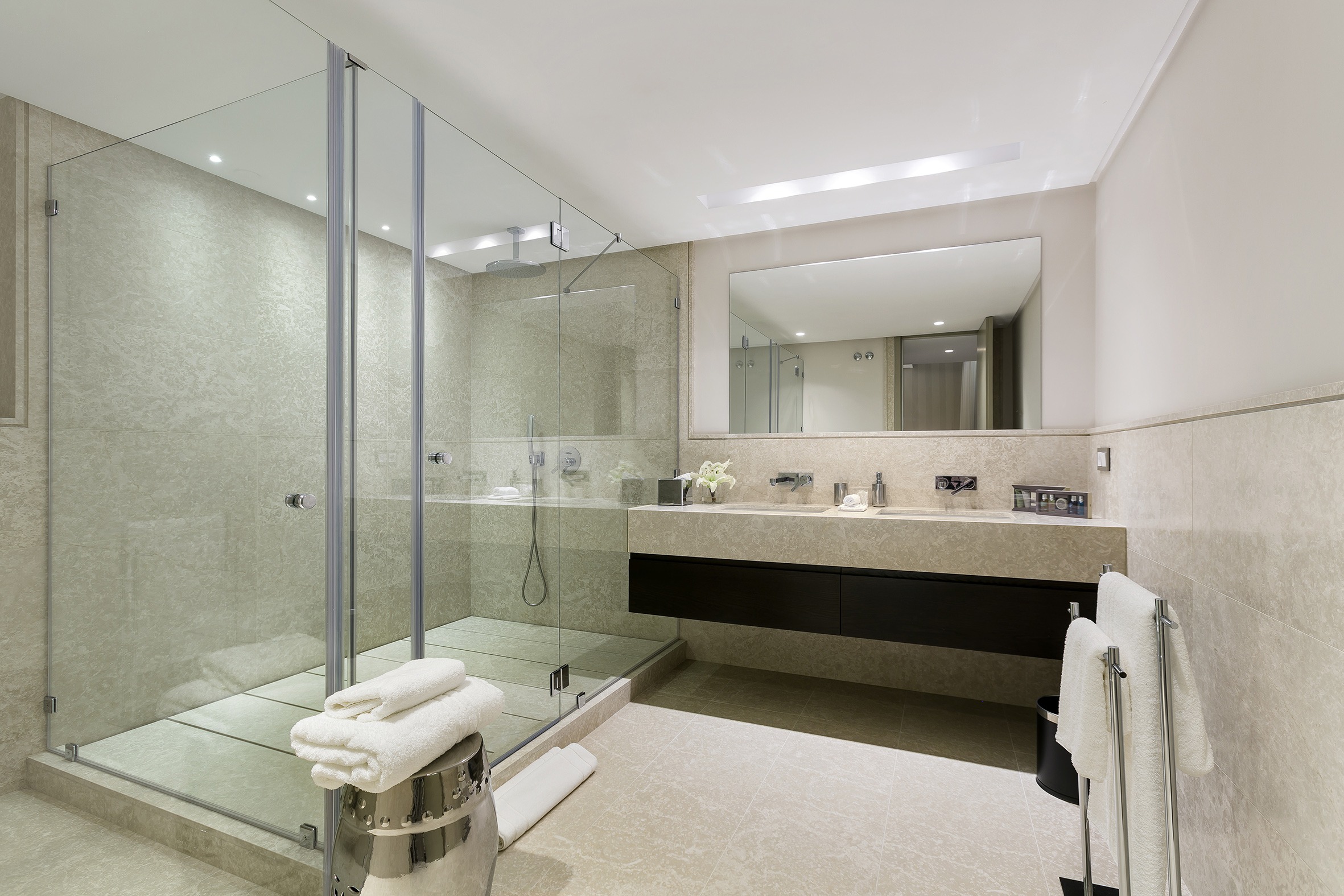 Luxury Bathroom with beige tiles double sink and big shower - Original Interiors