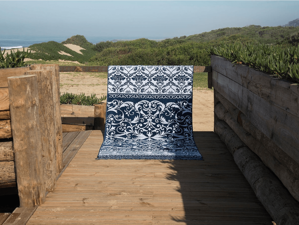 Printed towel dark blue and white on beach wooden deck - Original Interiors