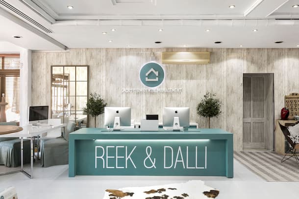 Office area with turquoise desk with brand name - Originals Interiors