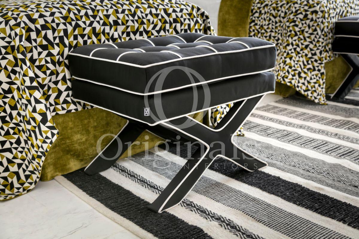 Black soft stools and mosaic patterned bed sheets - Originals Interiors