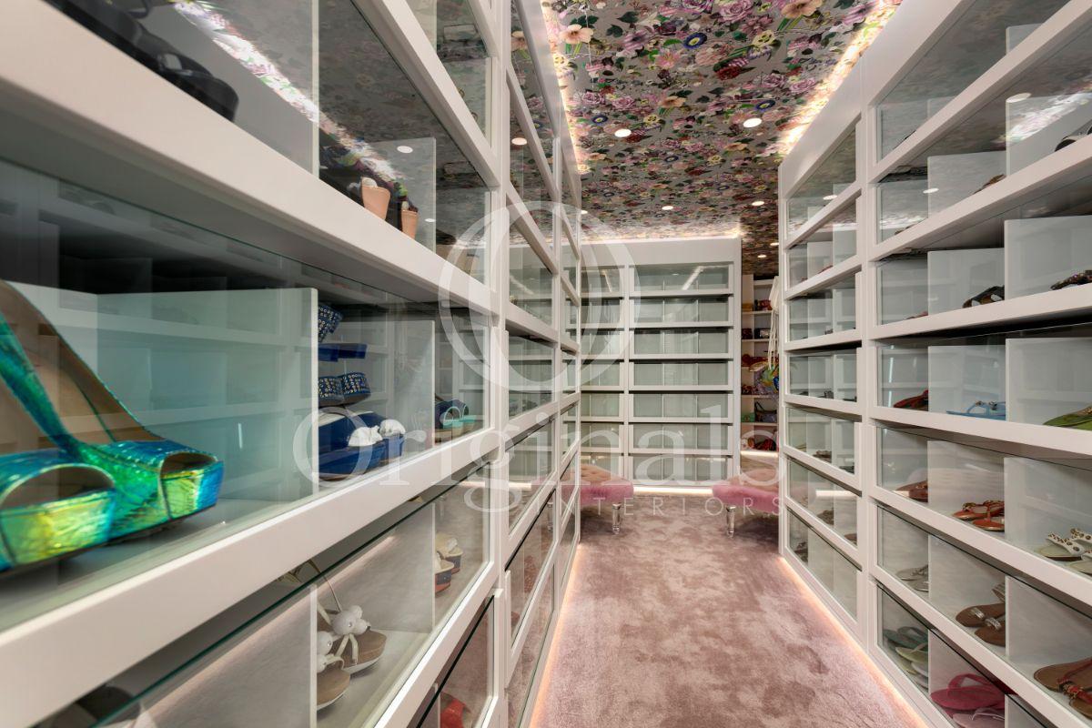 Walk in closet with pink carpet and a flower printed ceiling - Originals Interiors