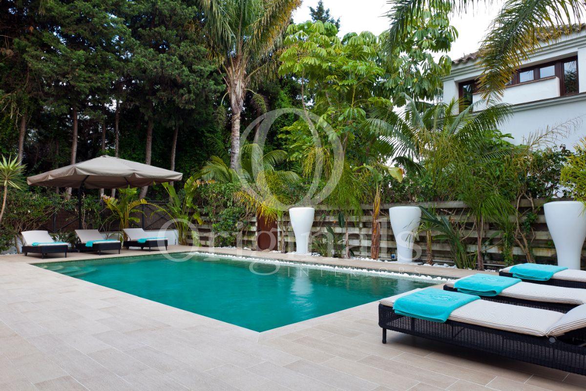 Outside area with sun loungers and a swimming pool - Originals Interiors