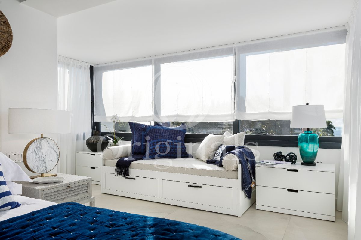 Whitemaster bedroom with marble bathroom velvet blue bed - Original Interiors