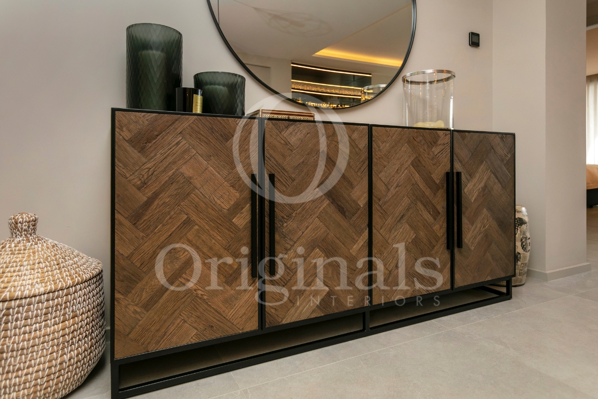 Wooden sideboard with black details, round mirror and green and glass decorations - Originals Interiors